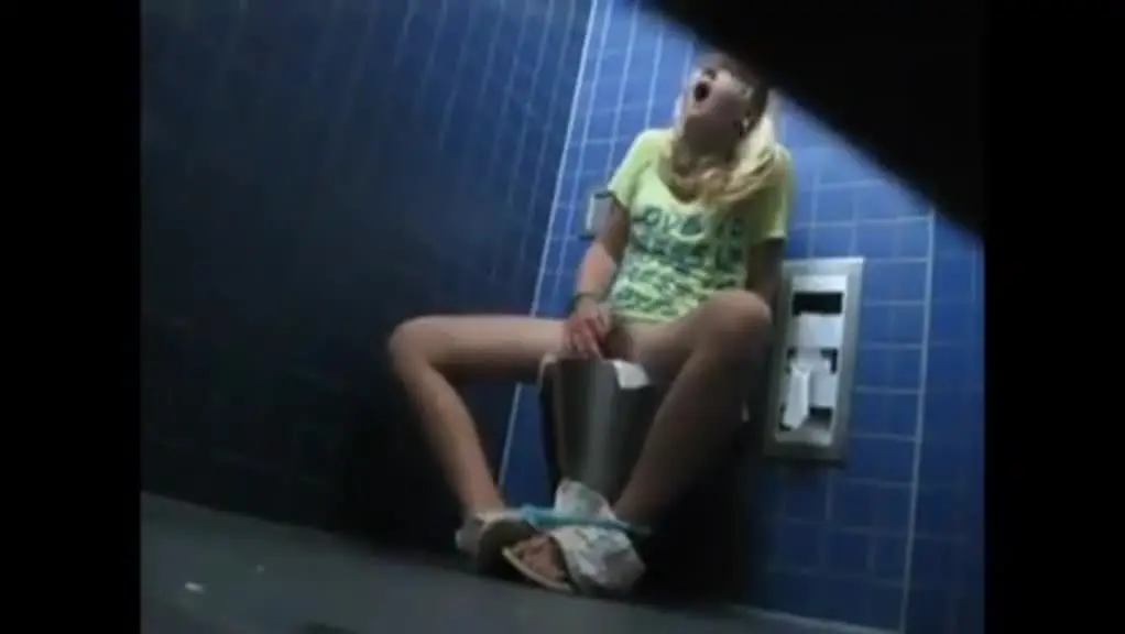 Secretly filming a girl playing with herself in the toilet, making her cry.