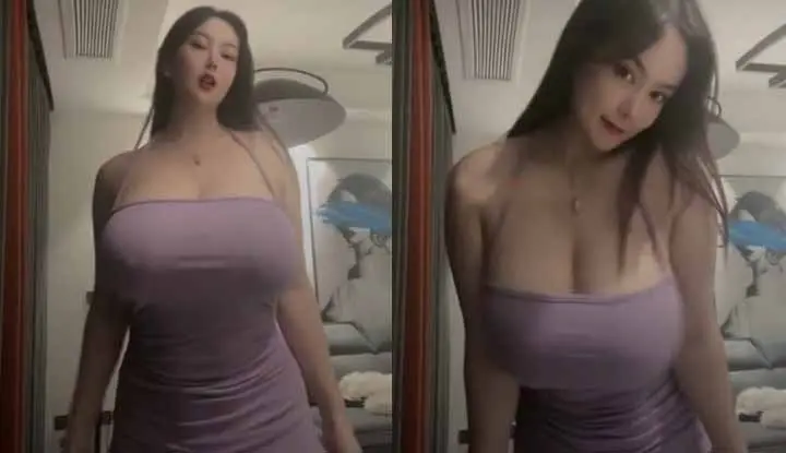 The busty beauty model has a pair of oversized car lights ~ her big breasts almost burst her clothes